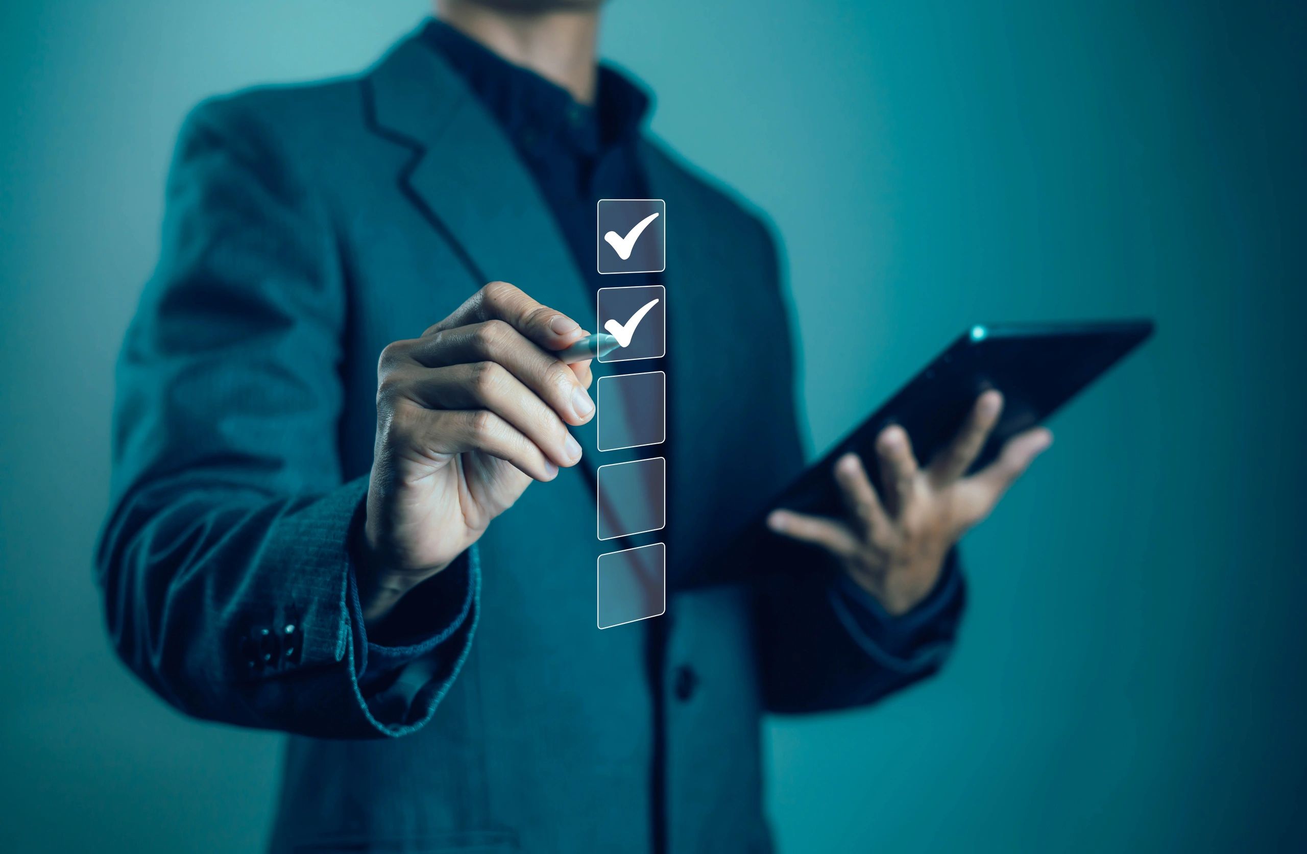 Professional reviewing company compliance documents on a tablet